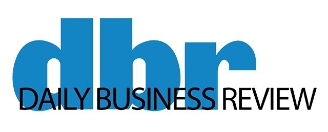 Logo of the Daily Business Review featuring stylized blue letters "dbr" above the publication's name in black text.